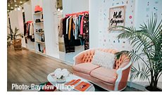 Pop Up Store - Seating area with curated 'melissa must haves' fashions on the wall. | Photo: Bayview Village