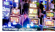 People looks at themed slot machines in the Scientific Games booth during the Global Gaming Expo at the Las Vegas Sands Expo and Convention Center on Thursday , Sept. 29, 2016. Photo: Jeff Scheid/Las Vegas Review-Journal